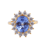 Oval Cut Lab Grown Blue Sapphire with Small Round White Moissanite Yellow Gold Ring